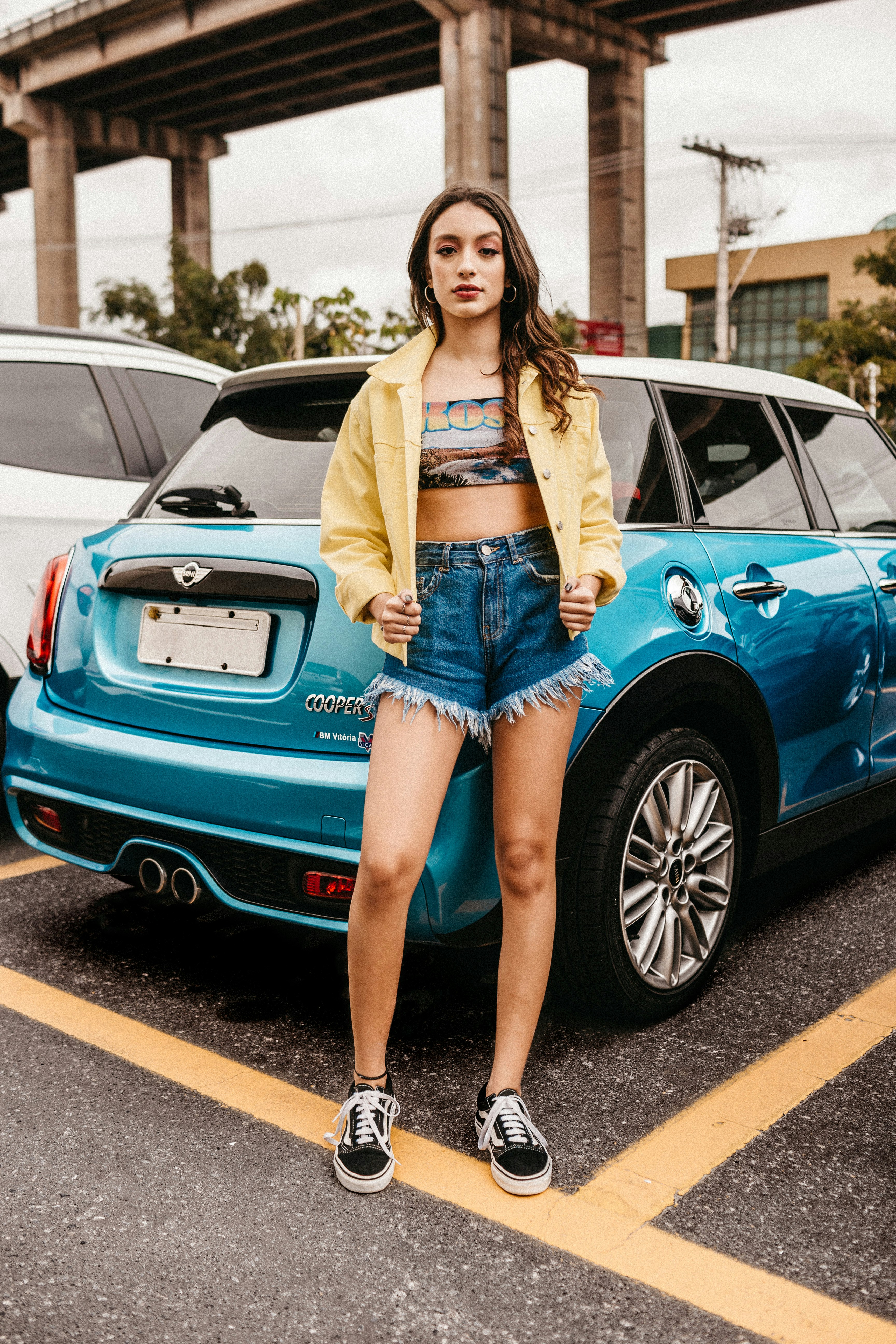 woman standing beside vehicle